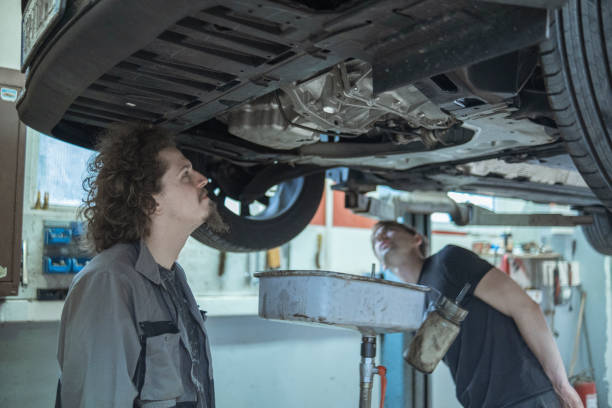 Mechanic Checking Car Oil Pan
